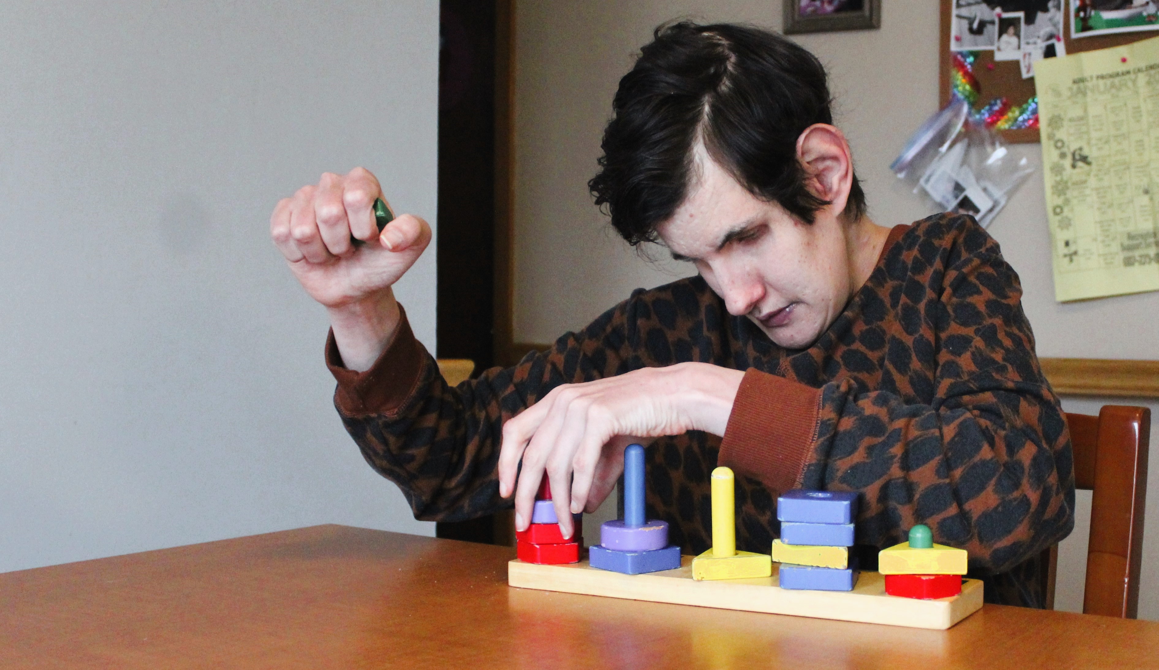 Resident at table with project